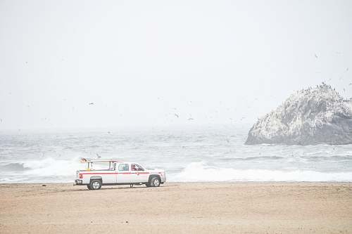 ocean beach white pickup truck near shore san francisco
